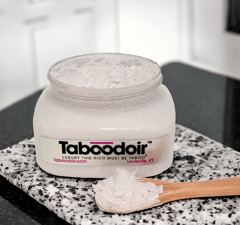 Open jar of Taboodoir Intoxicating Hand & Body Souffle Scrub with wooden spoon