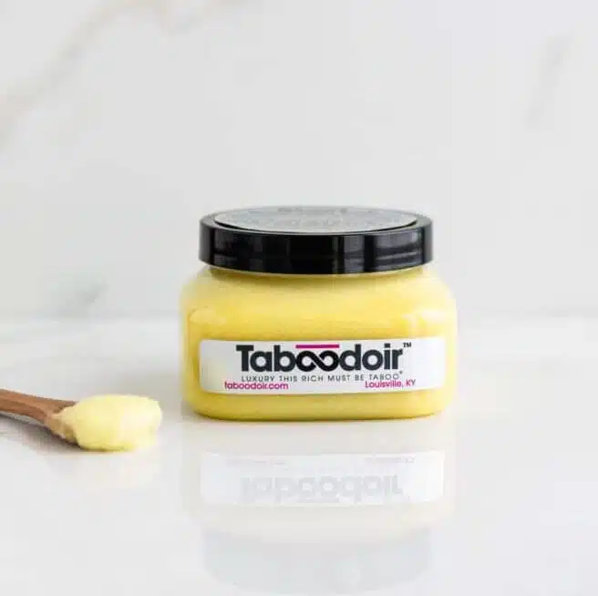 A jar and spoon of Citrus Bliss Body Polish