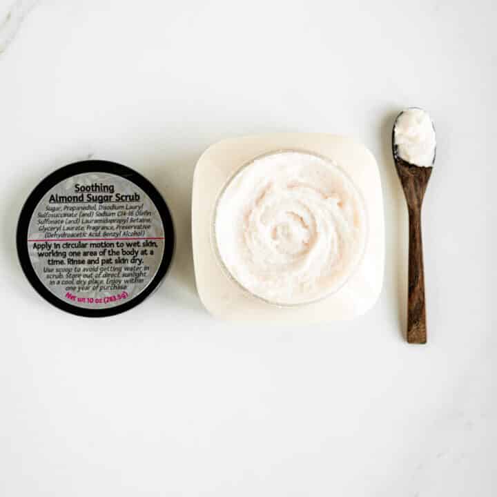 open jar of Taboodoir's Almond Affair Body Polish with spoon