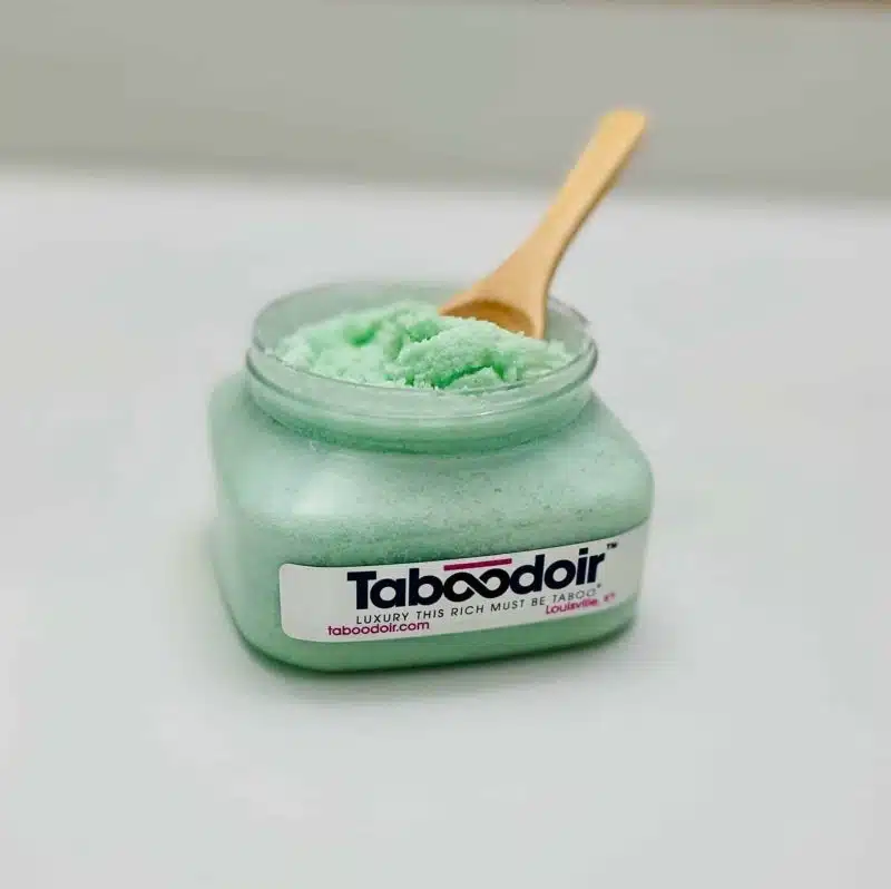 open jar of scrub with spoon in jar