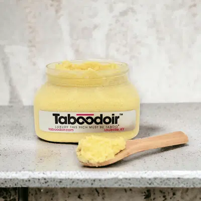 open jar of Taboodoir Citrus Radiance Brightening Polish with a wooden spoon