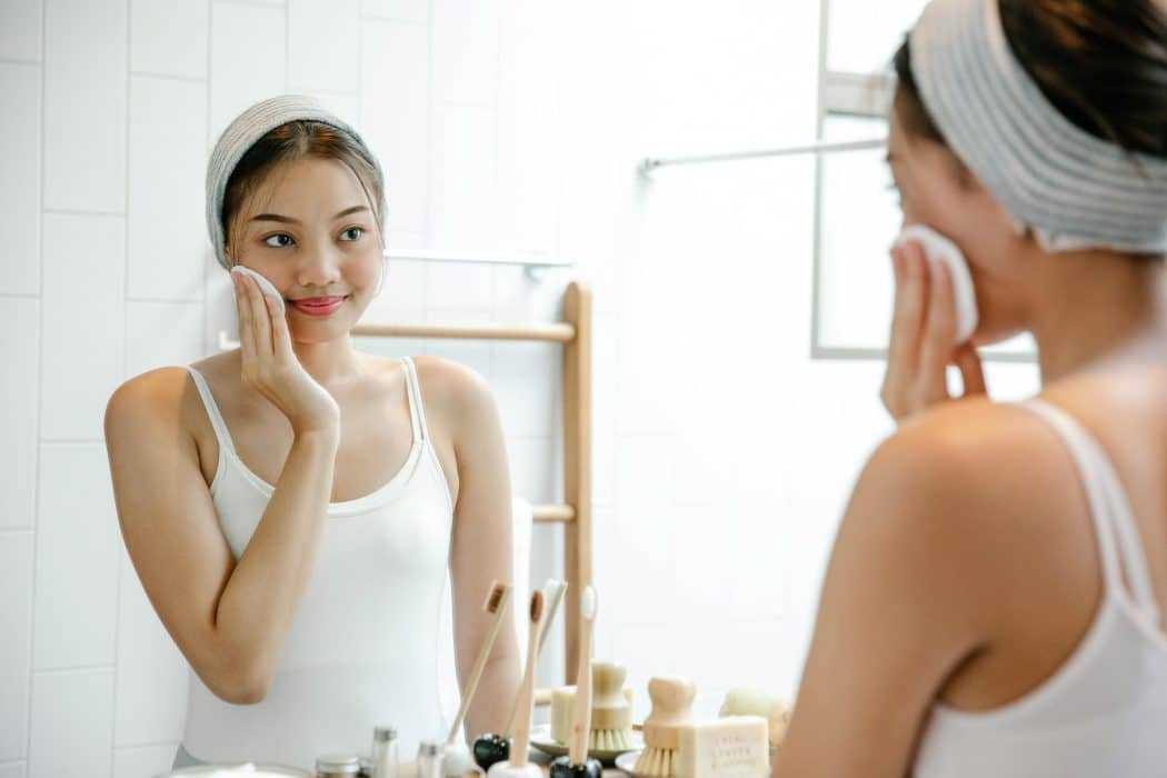 woman washing her face