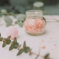 Pink Color Crystal Exfoliator in a Glass Bottle