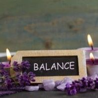 relaxing candles with balance sign
