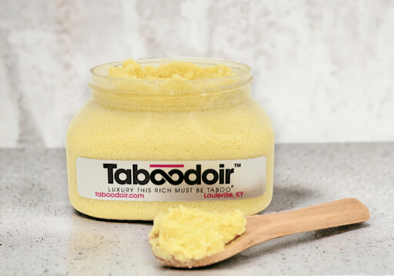 open jar of Taboodoir Citrus Radiance Brightening Polish with a wooden spoon