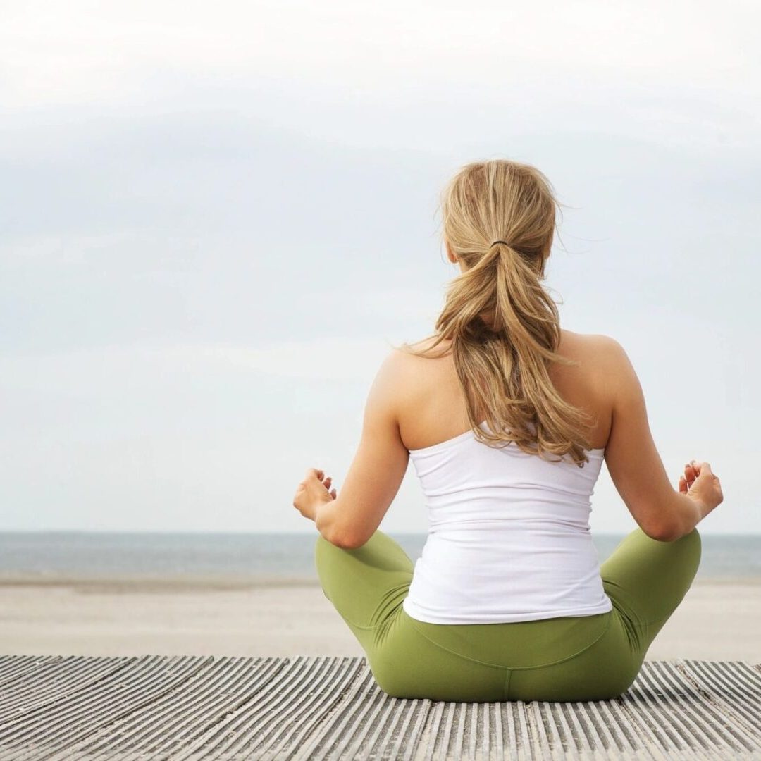 Woman sitting on a mat