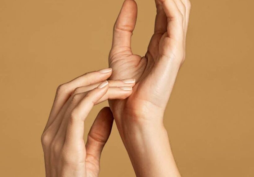 Two Hands in Air on a Biscuit Color Background